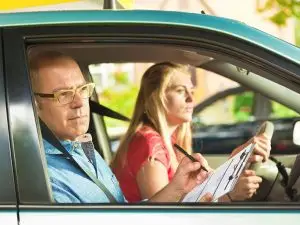 Driving instructor helping with Canadian License test